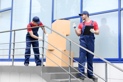 Professional office movers loading items in Notting Hill