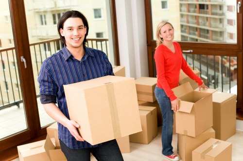 Professional movers loading belongings near a Notting Hill property with parking challenges